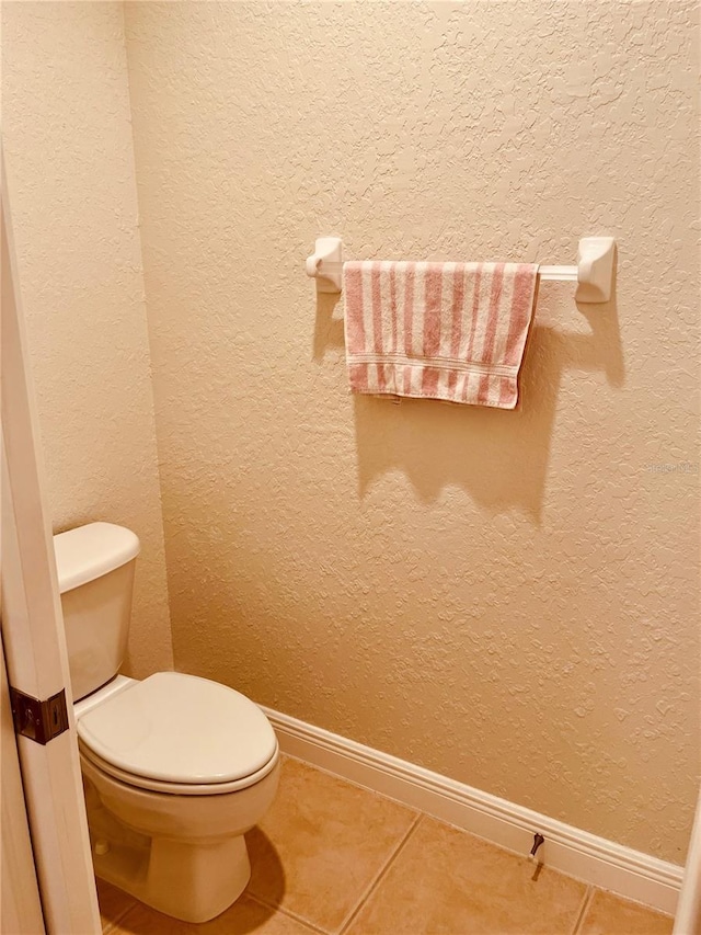 184 Banyan Bay Dr, Saint Petersburg, FL 33705 - bathroom featuring tile patterned floors, toilet, and baseboards
