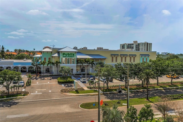 view of property's community with uncovered parking