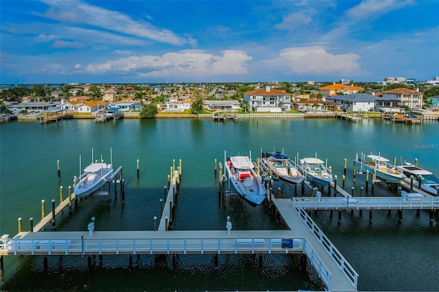 dock area with boat lift and a water view