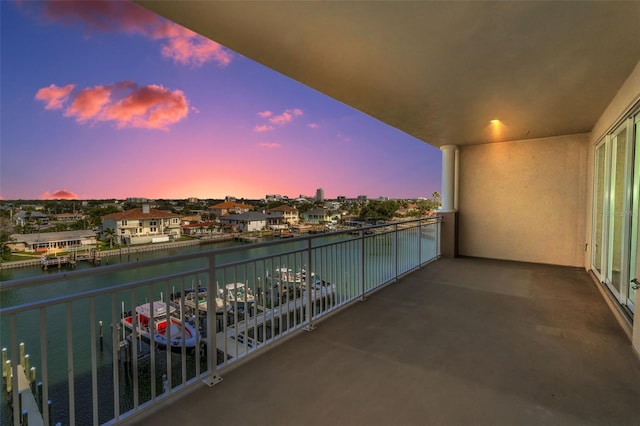 balcony featuring a water view