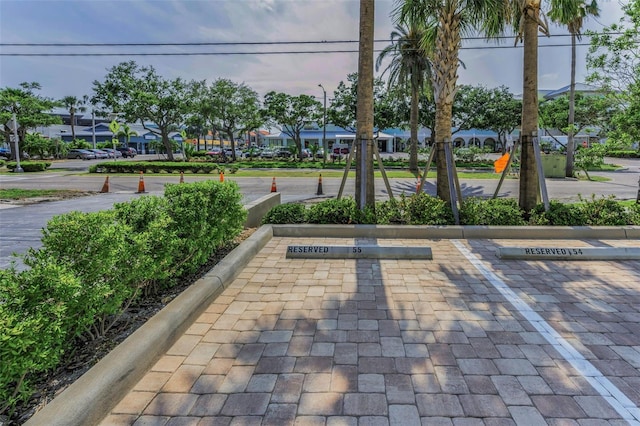 view of property's community with uncovered parking and a residential view