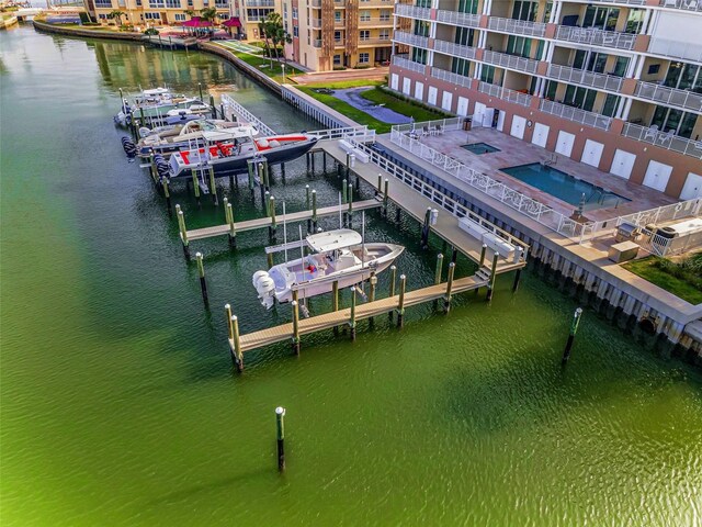 dock area with boat lift and a water view