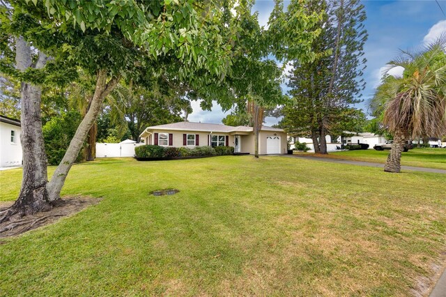 119 N Hillcrest Ave, Clearwater, FL 33755 - single story home featuring a garage and driveway