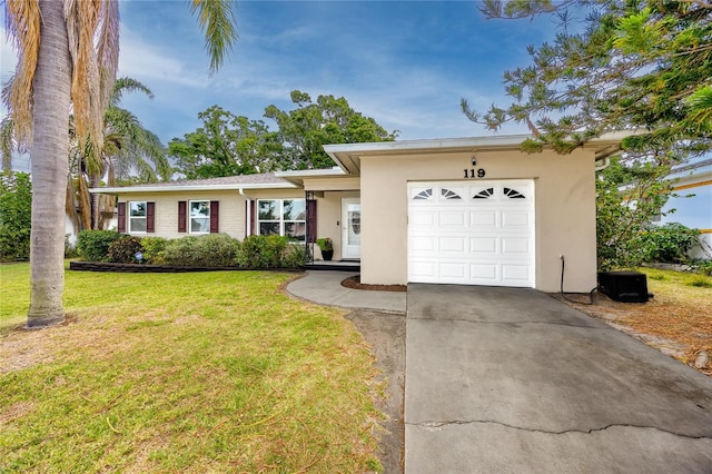 119 N Hillcrest Ave, Clearwater, FL 33755 - single story home with driveway, an attached garage, a front lawn, and stucco siding