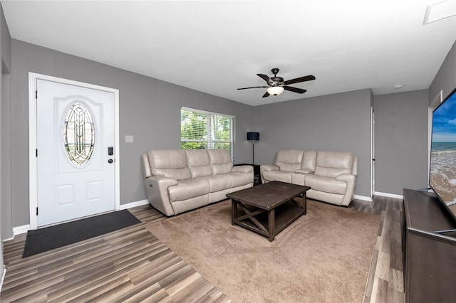 119 N Hillcrest Ave, Clearwater, FL 33755 - living room featuring wood finished floors, ceiling fan, and baseboards