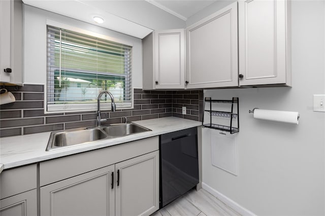 119 N Hillcrest Ave, Clearwater, FL 33755 - kitchen featuring black dishwasher, a sink, light countertops, decorative backsplash, and ornamental molding