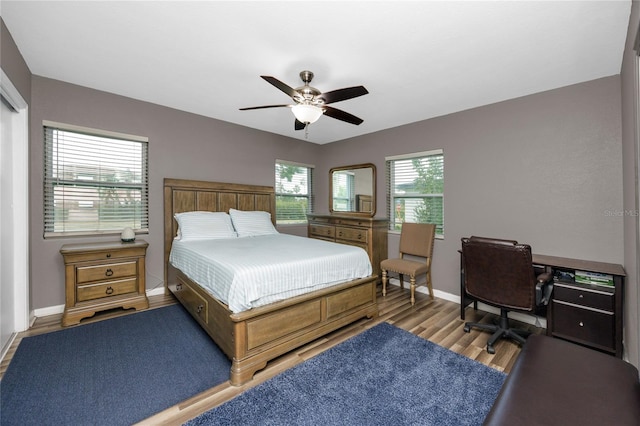 119 N Hillcrest Ave, Clearwater, FL 33755 - bedroom featuring wood finished floors, baseboards, and a ceiling fan