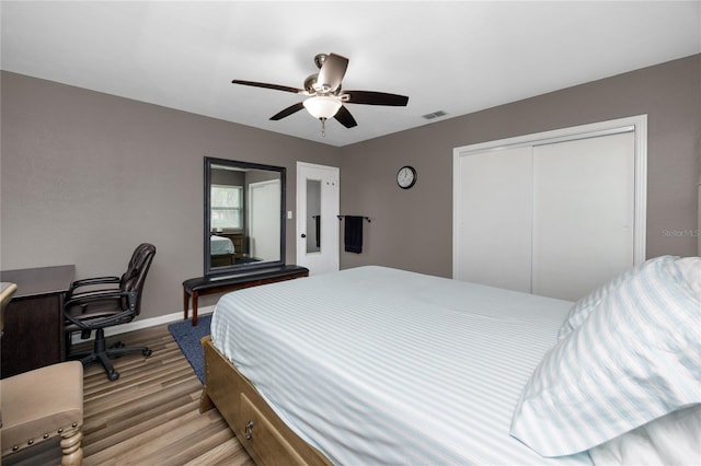 119 N Hillcrest Ave, Clearwater, FL 33755 - bedroom featuring light wood-style floors, a closet, baseboards, and ceiling fan