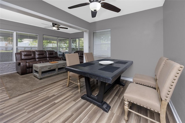 119 N Hillcrest Ave, Clearwater, FL 33755 - dining room featuring a ceiling fan and light wood-style flooring