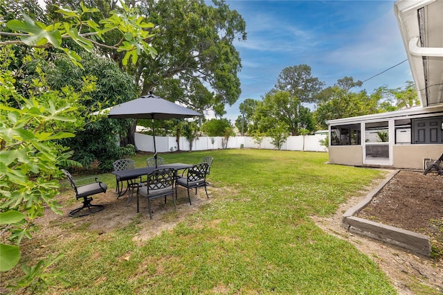 119 N Hillcrest Ave, Clearwater, FL 33755 - view of yard with a sunroom and outdoor dining space