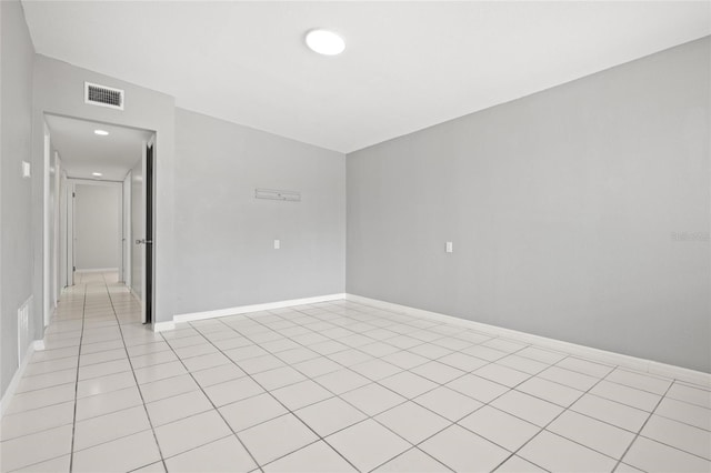 1858 Oregon Ave NE, Saint Petersburg, FL 33703 - spare room with light tile patterned floors, baseboards, and recessed lighting
