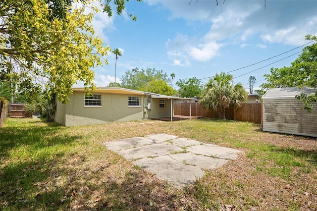 1858 Oregon Ave NE, Saint Petersburg, FL 33703 - view of yard with a patio, a storage shed, and an outbuilding