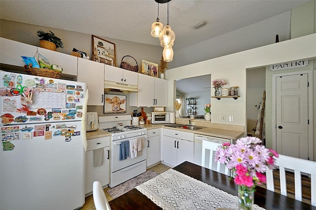 759 Cape Cod Cir, Valrico, FL 33594 - kitchen with white appliances, under cabinet range hood, light countertops, white cabinetry, and a textured ceiling