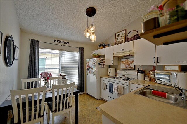 759 Cape Cod Cir, Valrico, FL 33594 - kitchen with white appliances, a textured ceiling, a sink, under cabinet range hood, and white cabinets