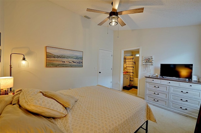 759 Cape Cod Cir, Valrico, FL 33594 - bedroom featuring light colored carpet, ensuite bathroom, ceiling fan, and lofted ceiling