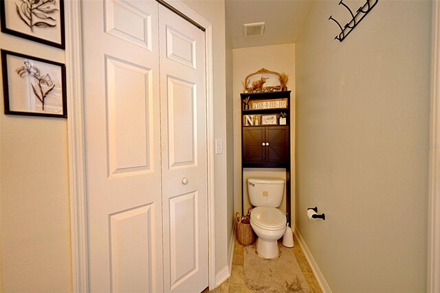 759 Cape Cod Cir, Valrico, FL 33594 - bathroom featuring toilet, baseboards, and tile patterned flooring
