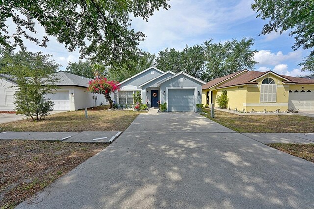 759 Cape Cod Cir, Valrico, FL 33594 - ranch-style house featuring a garage, driveway, stucco siding, and a front yard