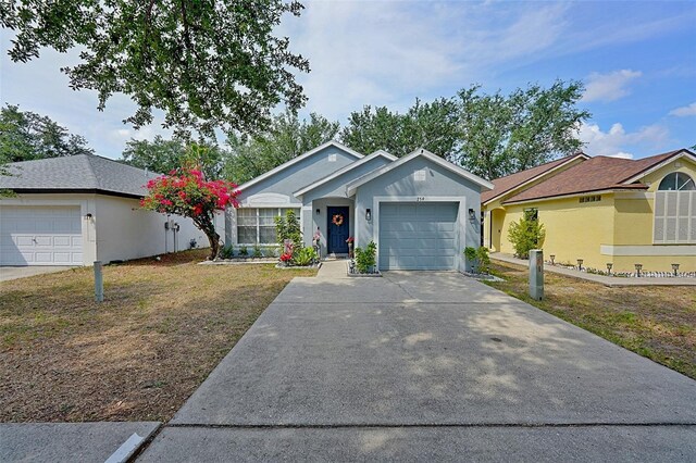 759 Cape Cod Cir, Valrico, FL 33594 - single story home with an attached garage, concrete driveway, a front yard, and stucco siding