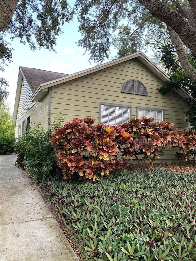 2390 Bentley Dr, Palm Harbor, FL 34684 - view of property exterior with roof with shingles