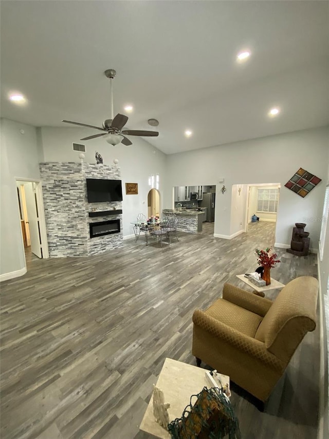 2390 Bentley Dr, Palm Harbor, FL 34684 - living area with a ceiling fan, baseboards, wood finished floors, recessed lighting, and lofted ceiling