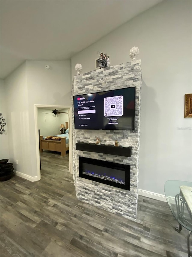 2390 Bentley Dr, Palm Harbor, FL 34684 - living area with baseboards, a stone fireplace, and wood finished floors