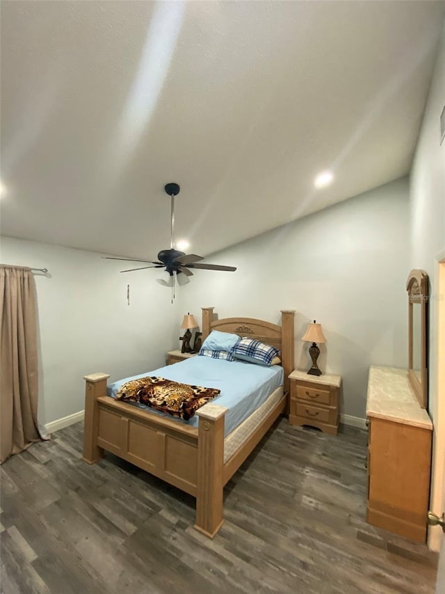 2390 Bentley Dr, Palm Harbor, FL 34684 - bedroom featuring dark wood finished floors, baseboards, ceiling fan, and lofted ceiling