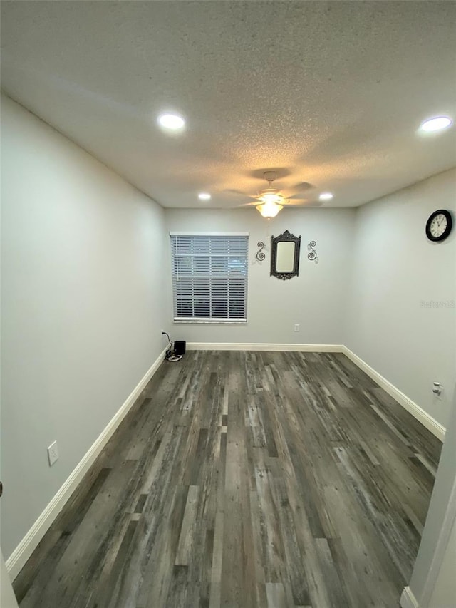 2390 Bentley Dr, Palm Harbor, FL 34684 - unfurnished room featuring ceiling fan, recessed lighting, baseboards, dark wood-type flooring, and a textured ceiling