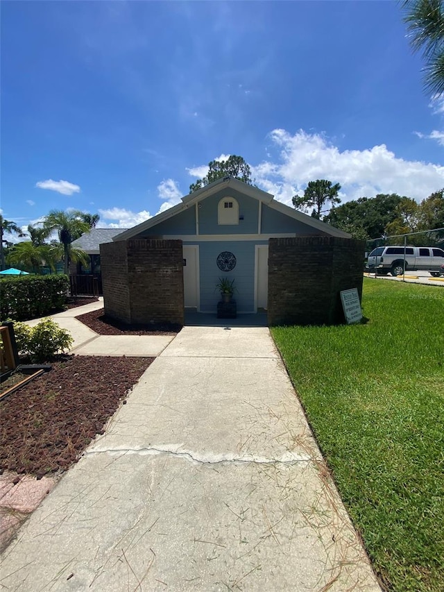 2390 Bentley Dr, Palm Harbor, FL 34684 - single story home featuring a front lawn, brick siding, and driveway