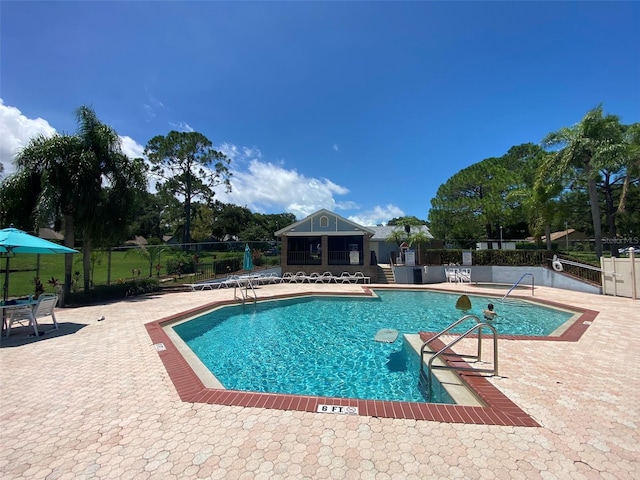 2390 Bentley Dr, Palm Harbor, FL 34684 - community pool with fence and a patio area