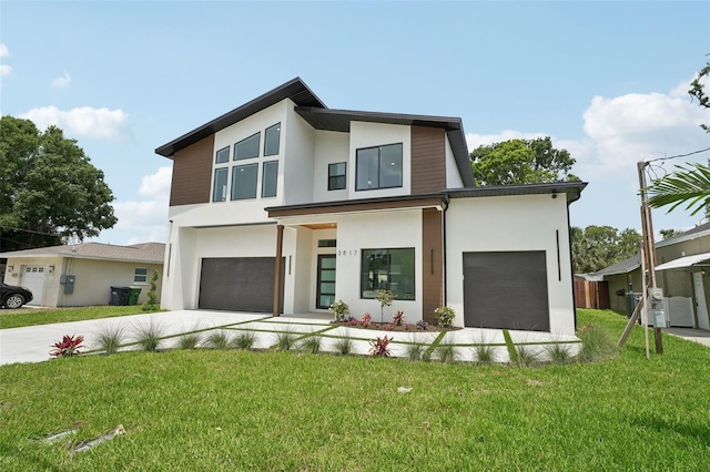 3817 W San Nicholas St, Tampa, FL 33629 - modern home with stucco siding, driveway, a garage, and a front yard