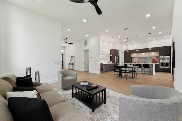 3817 W San Nicholas St, Tampa, FL 33629 - living room featuring ceiling fan, recessed lighting, and light wood-style flooring