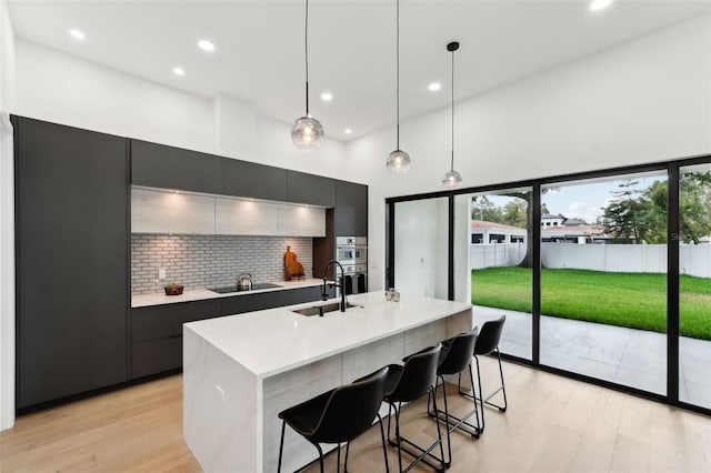 3817 W San Nicholas St, Tampa, FL 33629 - kitchen featuring modern cabinets, a sink, healthy amount of natural light, backsplash, and recessed lighting
