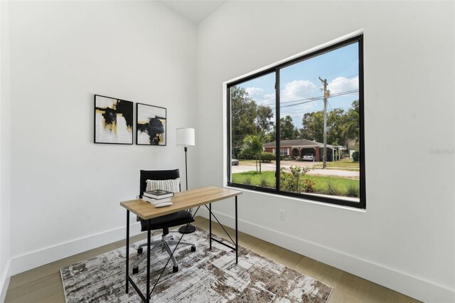 3817 W San Nicholas St, Tampa, FL 33629 - office area with baseboards and wood finished floors