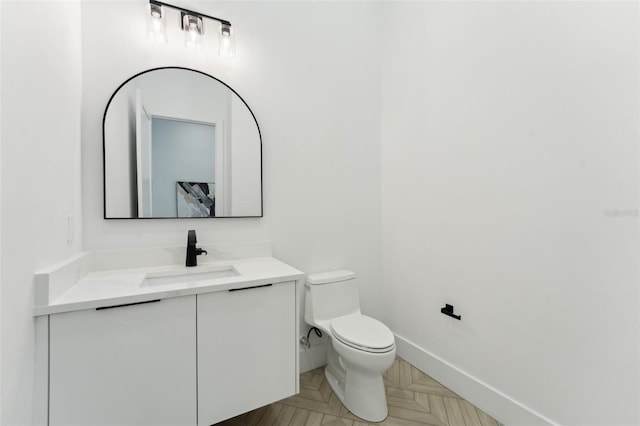 3817 W San Nicholas St, Tampa, FL 33629 - half bathroom featuring toilet, baseboards, and vanity