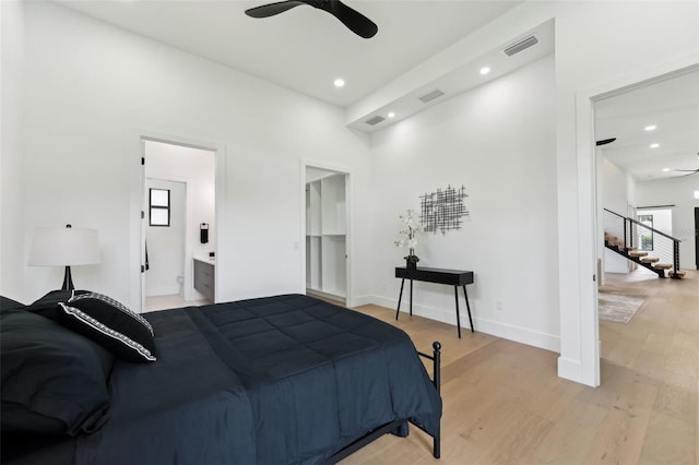 3817 W San Nicholas St, Tampa, FL 33629 - bedroom featuring multiple windows, light wood finished floors, recessed lighting, ensuite bathroom, and baseboards