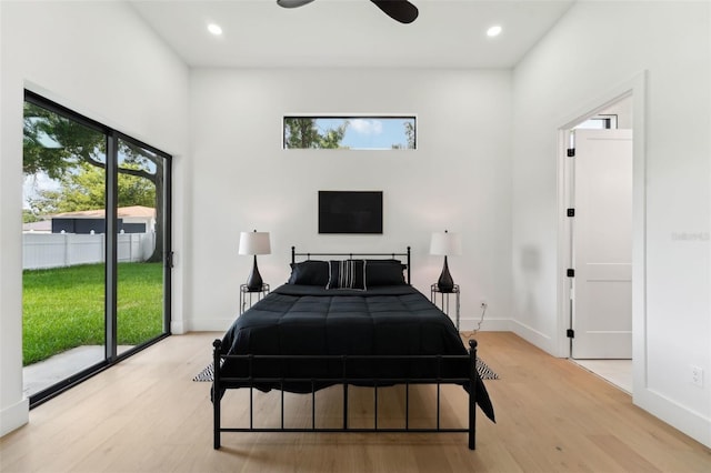3817 W San Nicholas St, Tampa, FL 33629 - bedroom with access to exterior, light wood-style floors, recessed lighting, a high ceiling, and baseboards