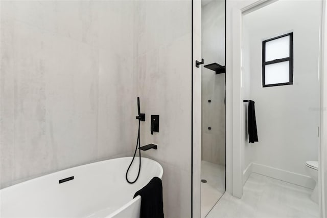 3817 W San Nicholas St, Tampa, FL 33629 - full bathroom with a freestanding bath, walk in shower, toilet, and baseboards