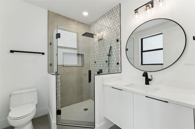 3817 W San Nicholas St, Tampa, FL 33629 - bathroom featuring toilet, vanity, a shower stall, recessed lighting, and baseboards