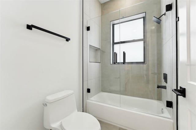 3817 W San Nicholas St, Tampa, FL 33629 - bathroom featuring toilet and combined bath / shower with glass door