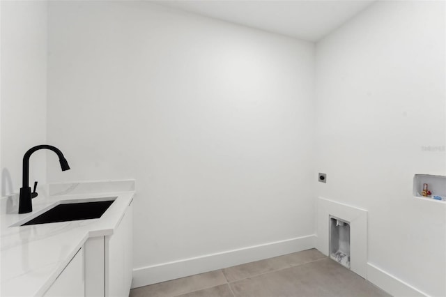 3817 W San Nicholas St, Tampa, FL 33629 - clothes washing area featuring cabinet space, hookup for an electric dryer, hookup for a washing machine, light tile patterned floors, and baseboards