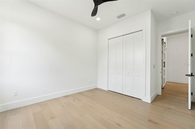3817 W San Nicholas St, Tampa, FL 33629 - unfurnished bedroom with light wood finished floors, baseboards, a closet, recessed lighting, and ceiling fan