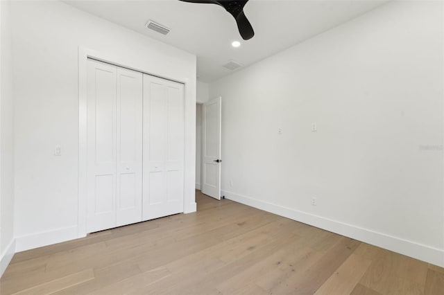 3817 W San Nicholas St, Tampa, FL 33629 - unfurnished bedroom with baseboards, light wood-style flooring, a closet, recessed lighting, and a ceiling fan