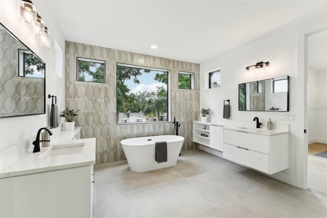 3817 W San Nicholas St, Tampa, FL 33629 - bathroom featuring two vanities, a soaking tub, and recessed lighting