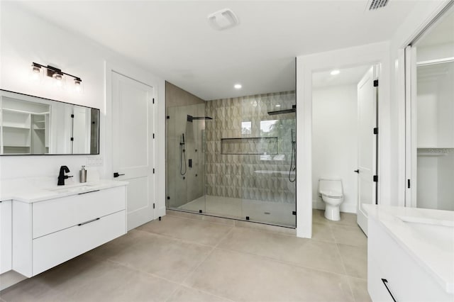 3817 W San Nicholas St, Tampa, FL 33629 - full bathroom featuring a shower stall, two vanities, tile patterned floors, recessed lighting, and toilet
