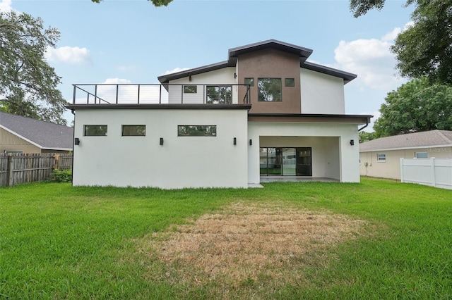 3817 W San Nicholas St, Tampa, FL 33629 - rear view of property with a balcony and stucco siding