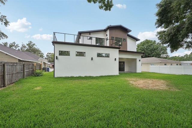 3817 W San Nicholas St, Tampa, FL 33629 - rear view of house featuring stucco siding, a balcony, and central AC
