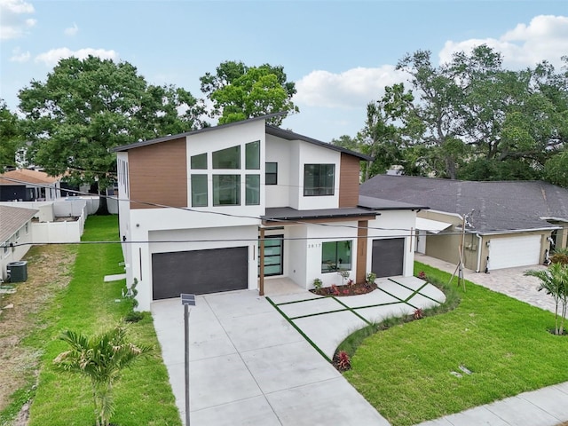 3817 W San Nicholas St, Tampa, FL 33629 - contemporary home with driveway, stucco siding, central AC, and an attached garage