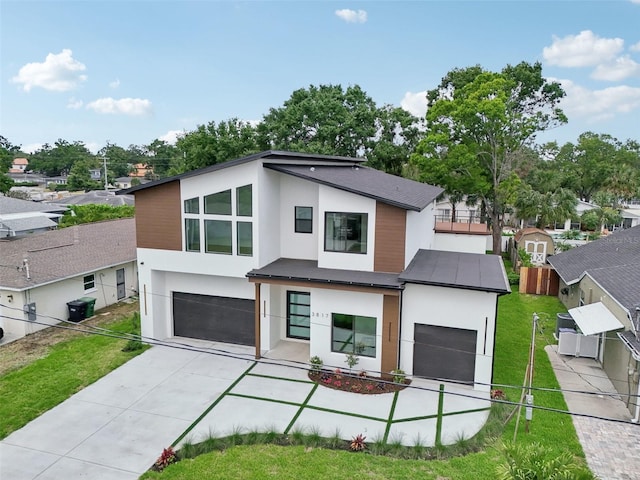 3817 W San Nicholas St, Tampa, FL 33629 - modern home featuring stucco siding, a garage, concrete driveway, and cooling unit
