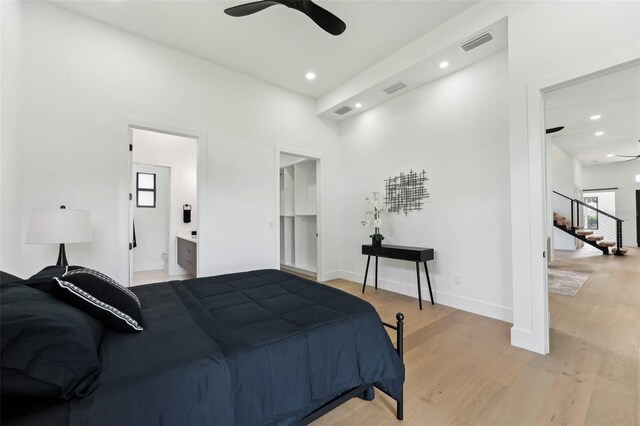 3817 W San Nicholas St, Tampa, FL 33629 - bedroom with multiple windows, light wood finished floors, recessed lighting, ensuite bath, and a ceiling fan