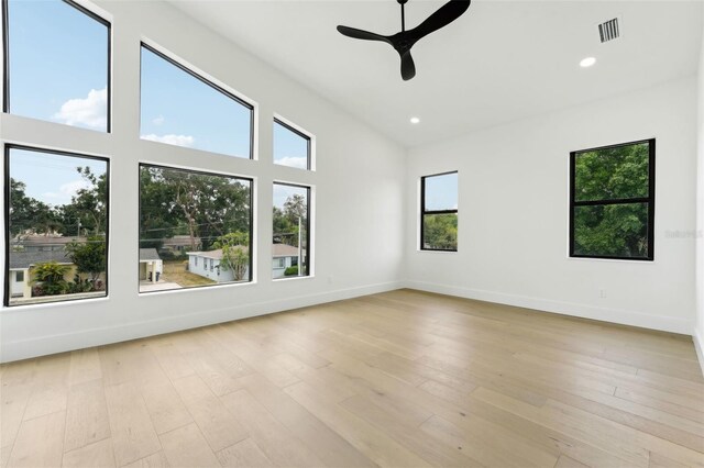 3817 W San Nicholas St, Tampa, FL 33629 - unfurnished room with ceiling fan, recessed lighting, light wood-style floors, and a high ceiling